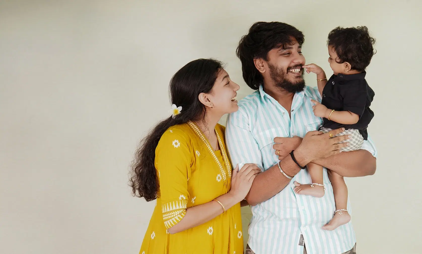 Happy family with baby in a joyful moment